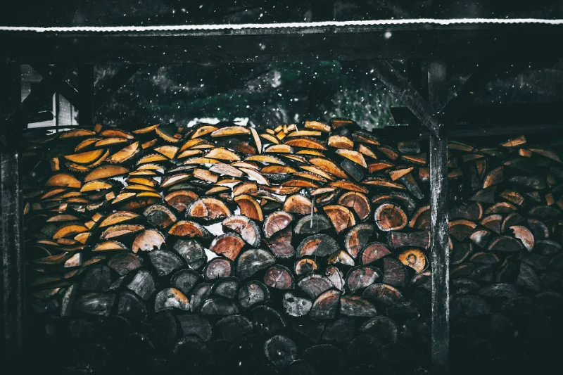 Open-sided firewood shed with a covered top for winter storage